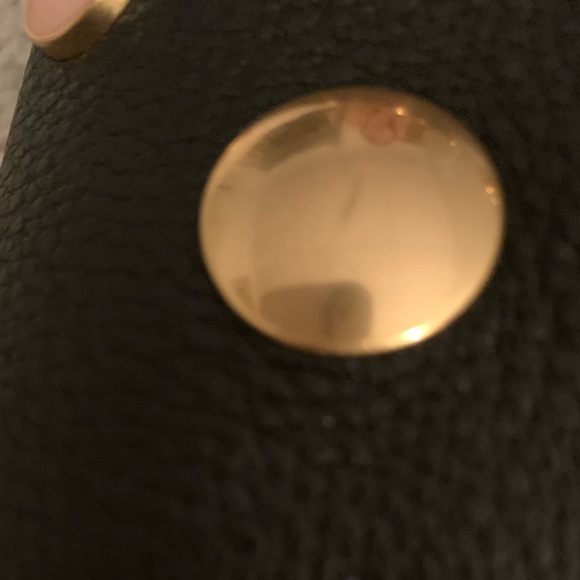 Tory Burch—100% leather. This bag has lots of room, three pockets. - Picture 6 of 10